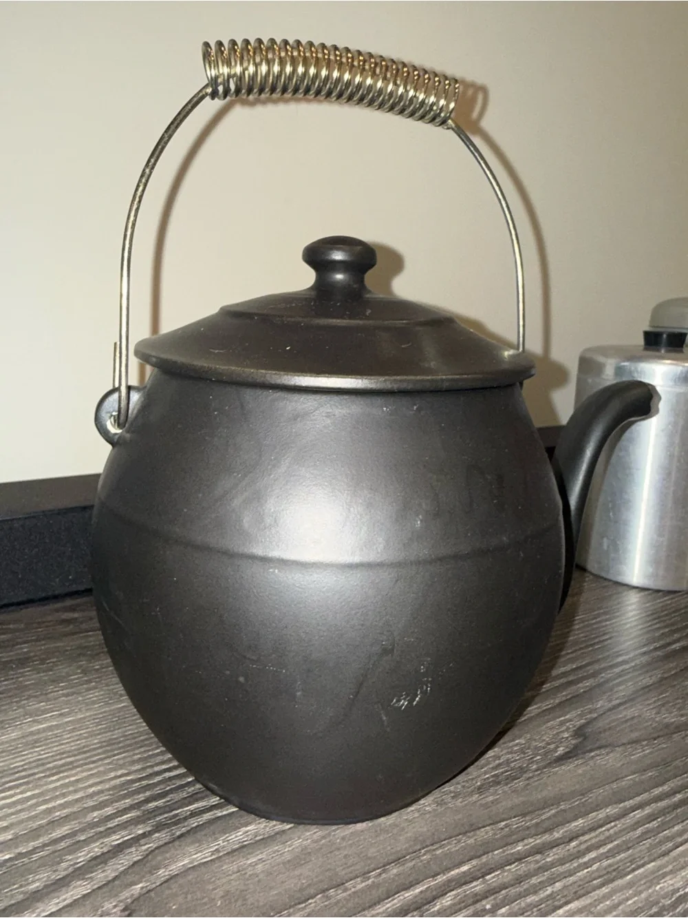 McCoy Pottery Kookie Kettle cookie jar crafted from black ceramic